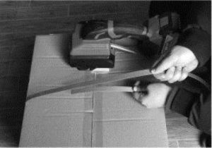 ATOM battery powered strapping tool in use