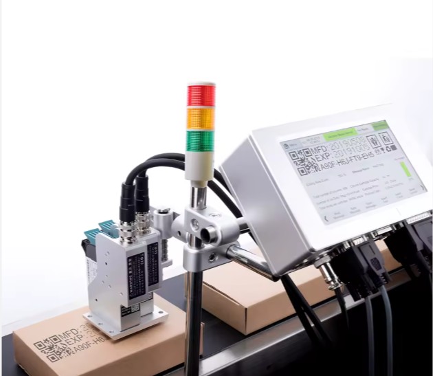 ST-210S-H2 controller and print heads above a carton on the line